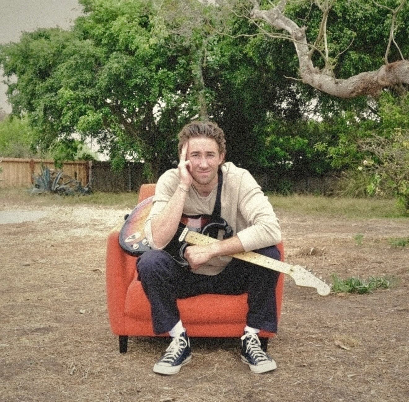 Jack Hadley holding his guitar in Los Angeles
